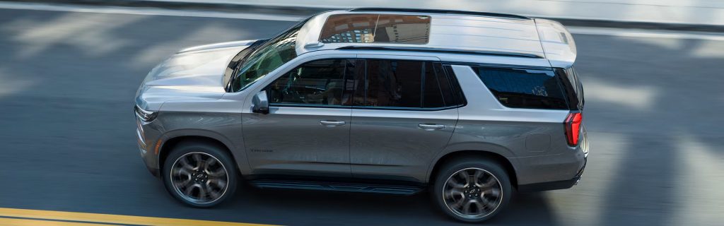 Chevy Tahoe riding in the city, perfect for whole family.