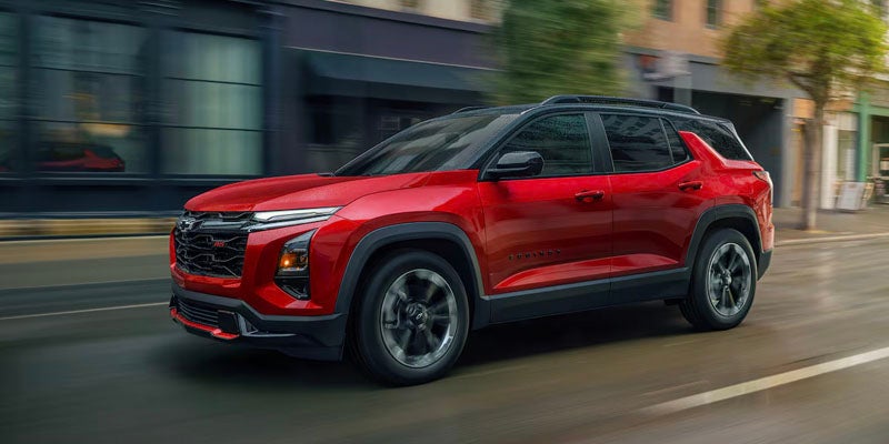 red 2025 Chevy Equinox driving in city