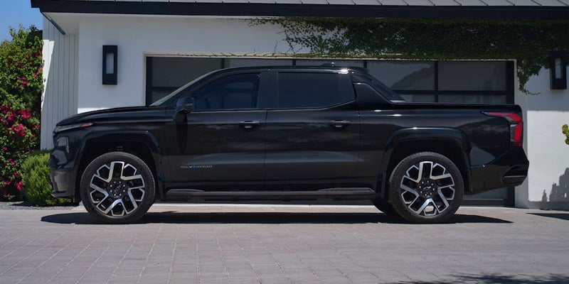 Side view of a black 2025 Chevy Silverado EV